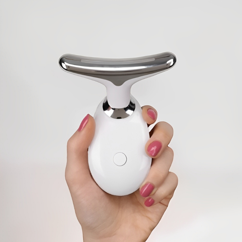 Sculpteur de Visage Ma boutique blanc et argent pour massage facial tenu en main